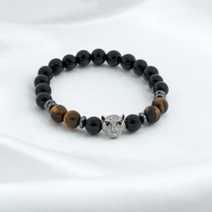 Sisäisen voiman rannekoru, jossa on pantrippi, onyx ja tiikerinsilmä kiviä.